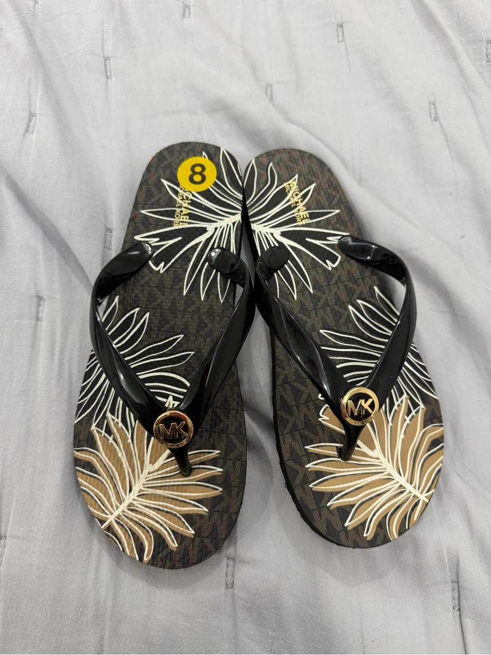 Michael Kors Black and Brown Tropical Logo Flip Flops
